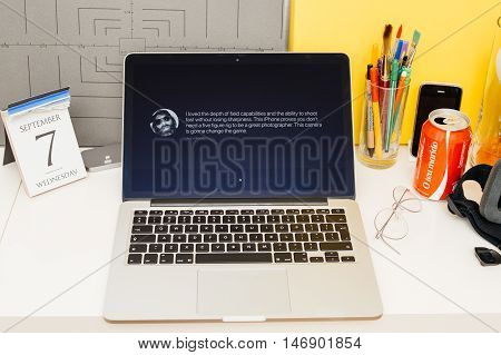PARIS FRANCE - SEP 8 2016: Apple Computers website on MacBook Retina in room environment showcasing live coverage of Apple Keynote - presentation of iPhone new photo camera double camera