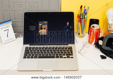 PARIS FRANCE - SEP 8 2016: Apple Computers website on MacBook Retina in room environment showcasing live coverage of Apple Keynote - presentation of iPhone new photo camera double camera