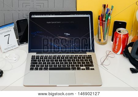 PARIS FRANCE - SEP 8 2016: Apple Computers website on MacBook Retina in room environment showcasing live coverage of Apple Keynote - Tim Cook informing about 17 million Apple Music Subscribers