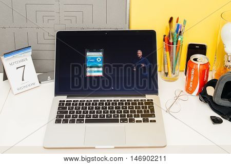 PARIS FRANCE - SEP 8 2016: Apple Computers website on MacBook Retina in room environment showcasing live coverage of Apple Keynote - apple pay