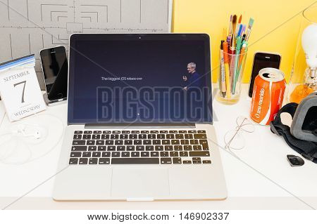 PARIS FRANCE - SEP 8 2016: Apple Computers website on MacBook Retina in room environment showcasing live coverage of Apple Keynote - `tim Cook the Biggest iOS release ever