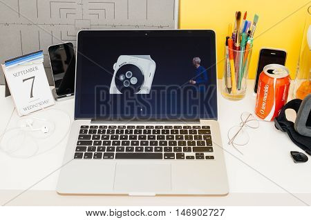PARIS FRANCE - SEP 8 2016: Apple Computers website on MacBook Retina in room environment showcasing live coverage of Apple Keynote - introducing ceramic Apple Watch