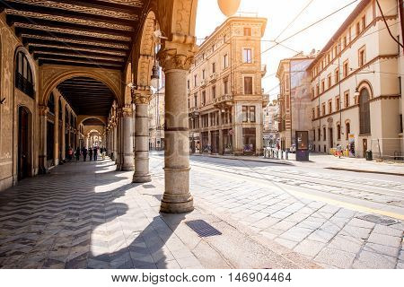 Turin, Italy - June 12, 2016: Street view with arch gallery and beautiful buildings in the center of Turin old town in Piedmont region in Italy