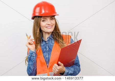 Woman Engineer Construction Builder In Helmet.
