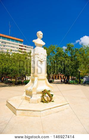 CIEGO DE AVILA, CUBA - SEPTEMBER 5, 2015: Main plaza square with statue, Downtown of Ciego de Avila. The city has a population of about 86, 100.