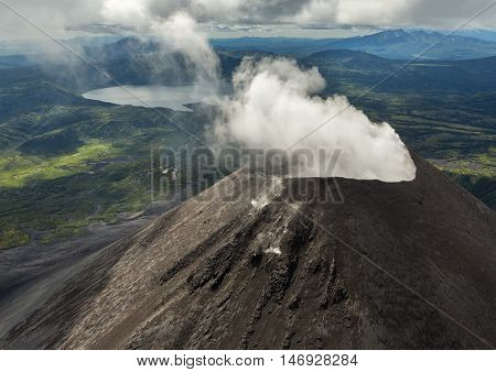 Karymsky is an active stratovolcano. Kronotsky Nature Reserve on Kamchatka Peninsula. View from helicopter.