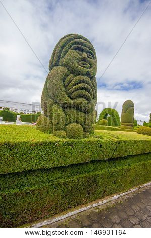 TULCAN, ECUADOR - JULY 3, 2016: incain sculpture in the garden of the cemetery.