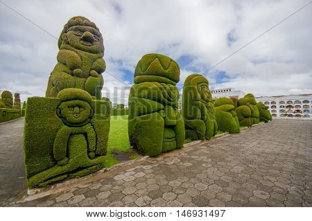 TULCAN, ECUADOR - JULY 3, 2016: some topiary figures located in the garden of the cemetery.