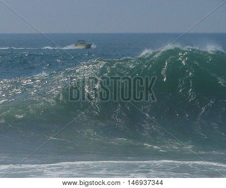 An unidentified boater surveys the big waves of The Wedge in Newport Beach, CA (September 2011)
