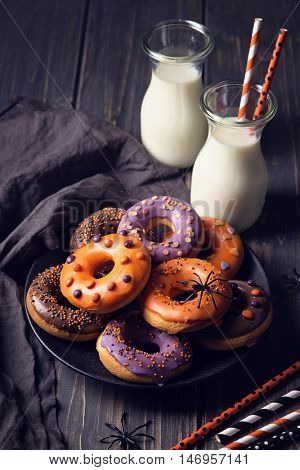 Halloweeen donuts on a dark wooden background