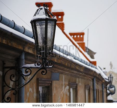 Antique street latern. Old-fashion street lighting on the wall