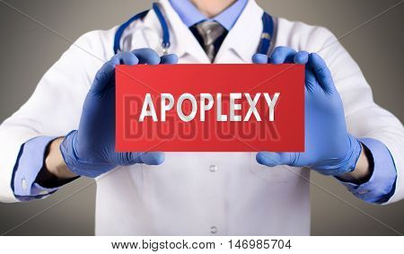 Doctor's hands in blue gloves shows the word apoplexy. Medical concept.