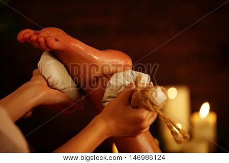Poultice massage herbal poultice foot. Therapy with Thai Reflexology for foot.
