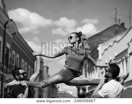 Active Lifestyle, Friends. Girl Or Pretty Woman, Fit Model, In Stylish Sunglasses And Blue Jeans Sit
