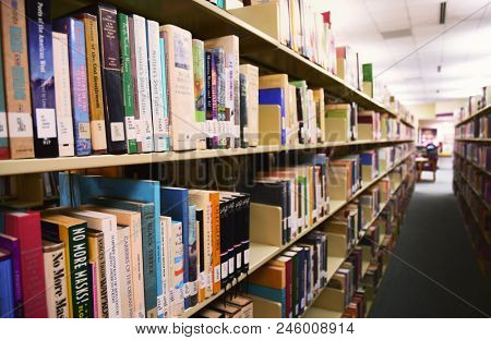 KALISPELL, MONTANA, USA - May 9, 2017: Regional books of stories from the American West line the shelves at Flathead Valley Community College Library
