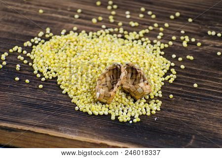 Millet In White Bowl On Brown Board. Wheat. Healthy Dietary Groats Background.
