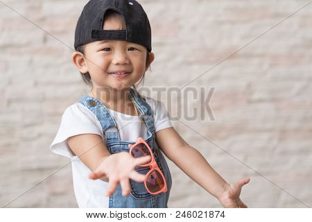 Asian Cute Baby Kid Happinese On White Brick Wall Background, Portrait Child Concepts.