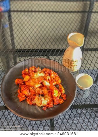 On Seletive Focus And Dark Image Of Fried Chicken Sauce Cook A Special Dish In Black. And The Teacup