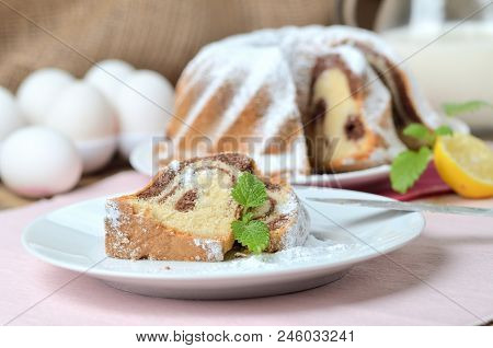 Cut Of Marble Cake Sprinkled With Sugar, Milk, Eggs, Melissa And Leaves, , Still Life With Marble Ca