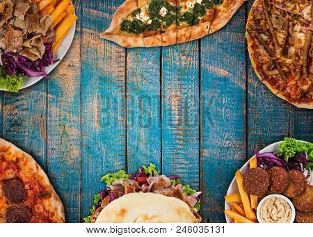 Top down view on traditional turkish meals on vintage wooden table. Close-up.