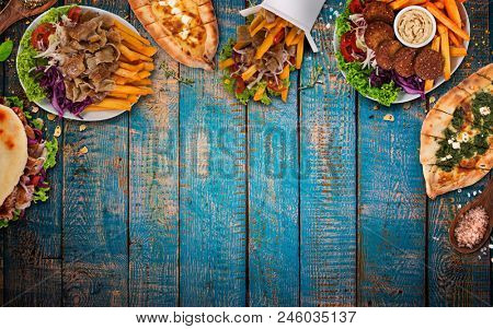 Top down view on traditional turkish meals on vintage wooden table. Close-up.