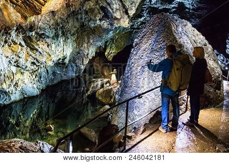 Han-sur-less, Belgium - April 29, 2017: Illuminated Multicolored Stalactites In Cave Han-sur-lesse I