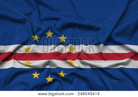 Cabo Verde Flag  Is Depicted On A Sports Cloth Fabric With Many Folds. Sport Team Waving Banner