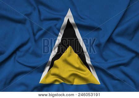 Saint Lucia Flag  Is Depicted On A Sports Cloth Fabric With Many Folds. Sport Team Waving Banner