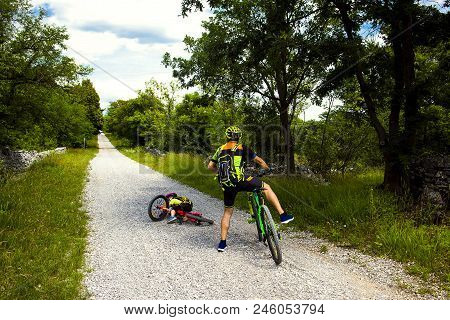 Father And Daughter Going In Bicycle. Little Girl Falling Off Her Bicycle, Family Cyclo Holidays, Su