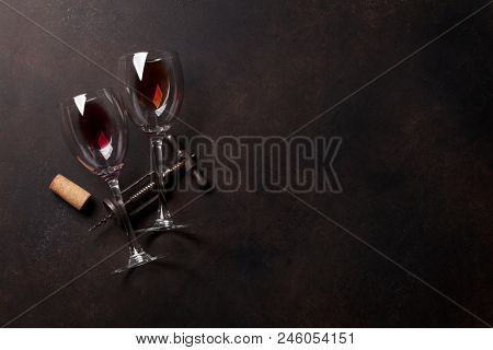 Wine glasses and vintage corkscrew. Top view with space for your text