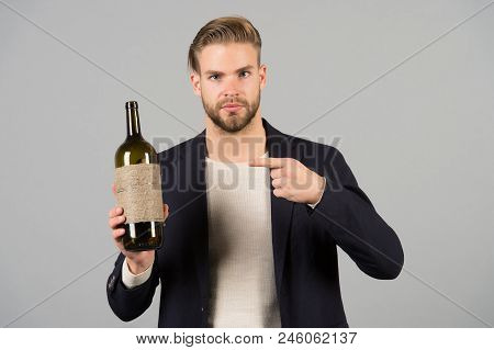You Should Try This. Man Holds Bottle Alcohol Drink. Social And Cultural Aspects Of Drinking. Busine
