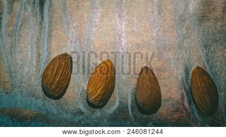 Raw Almonds Nuts On The Wooden Background