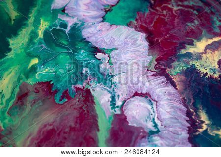 Abstraction Of The Flowing Multi-colored Acrylic Paints