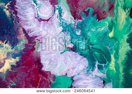 Abstraction Of The Flowing Multi-colored Acrylic Paints