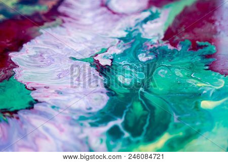 Abstraction Of The Flowing Multi-colored Acrylic Paints
