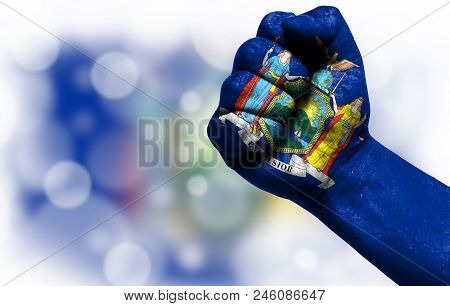 State Of New York Drawn On Male Fist, Strength, Power, Concept Of Conflict. On A Blurred Background 