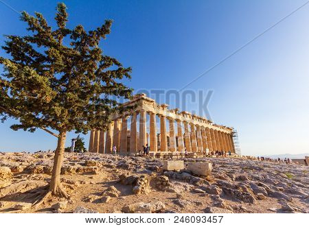 Tourists Walking Around And Taking Photos Of The Parthenon On The Acropolis