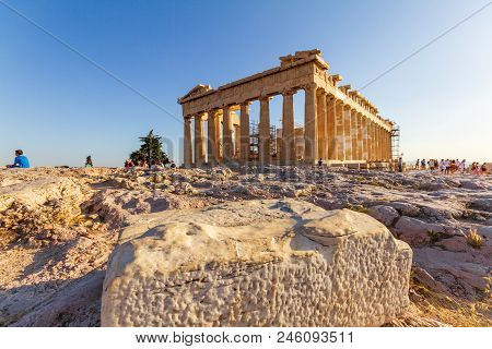 The Parthenon On The Acropolis Of Athens Surrounded By Tourists On A Summer Afternoon
