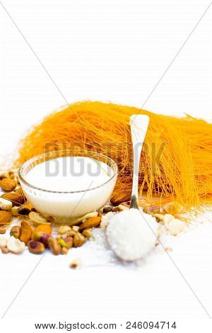 Close Up Of Raw Vermicelli Or Sevee Or Seviyan Or Seviyaan And Dry Fruits Isolated On White With A B