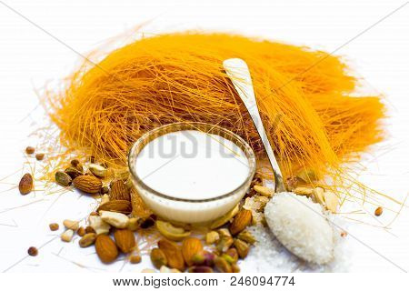 Close Up Of Raw Vermicelli Or Sevee Or Seviyan Or Seviyaan And Dry Fruits Isolated On White With A B