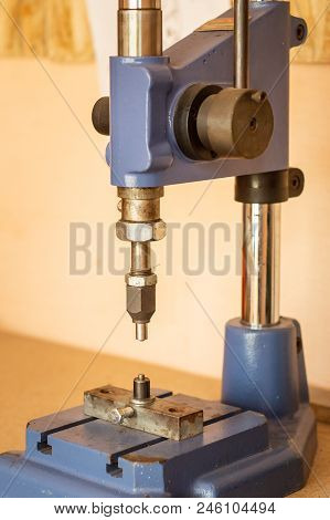 Pressing Machine In Clothes And Accessories Manufacture. Clench Installing Device At Workshop
