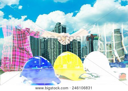 Double Exposureteam Of Profressional Engineers And Worker Are Shaking Hands While Working Safety Con
