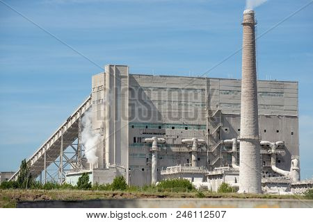 Smoke From Pipes In The Plant, Polluting The Environment. Dirty Air In The Sky.