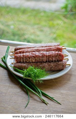 Raw Lulya Kebab From Meat On A White Plate.
