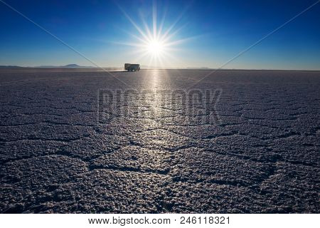 Salar de Uyuni at sunrise. Salt flat of the Salar de Uyuni during sunrise, Bolivia