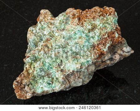 Macro Shooting Of Natural Mineral - Rough Pyrophyllite Stone On Black Granite From Ural Mountains