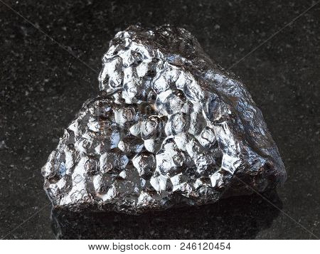 Macro Shooting Of Natural Rock Specimen - Raw Hematite (kidney Ore) Stone On Black Granite Backgroun