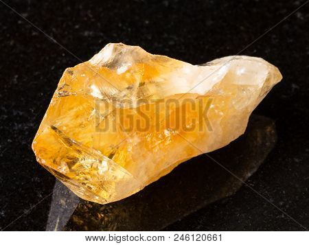 Macro Shooting Of Natural Rock Specimen - Raw Crystal Of Citrine (yellow Quartz) Gemstone On Black G