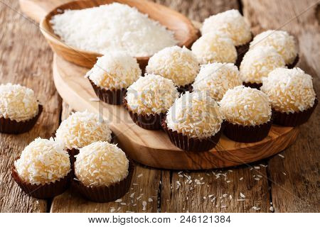 Appetizing Candy Balls Beijinhos De Coco With Condensed Milk And Coconut Close-up. Horizontal