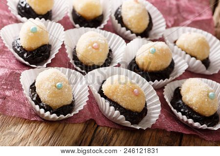 Home Children Candy Olho De Sogra From Condensed Milk, Plum And Coconut Sugar Close-up. Horizontal